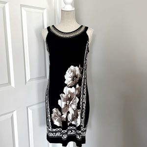 dc established 1962 sleeveless dress with silver neckline accents.